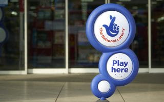 The UK National Lottery Logo Sign Infront of a Land-Based Location